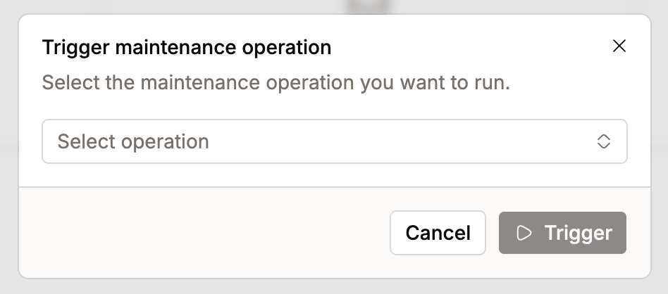 Trigger maintenance operation dialog with a Select operation dropdown and Cancel and Trigger buttons | IOMETE
