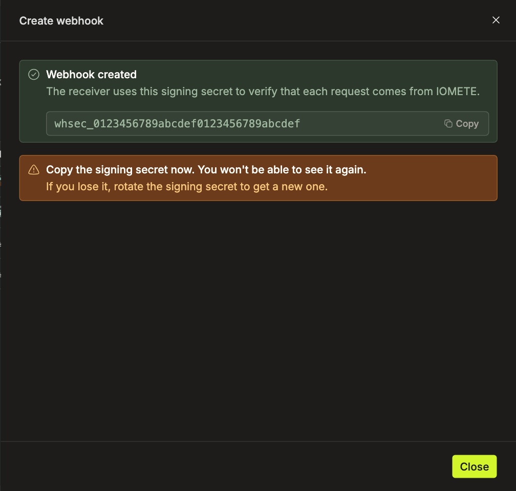 Webhook created panel showing the signing secret with a Copy button and a warning that it is shown only once | IOMETE